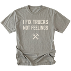 Grey t-shirt with bold distressed text reading I Fix Trucks Not Feelings and crossed wrench and hammer icon.