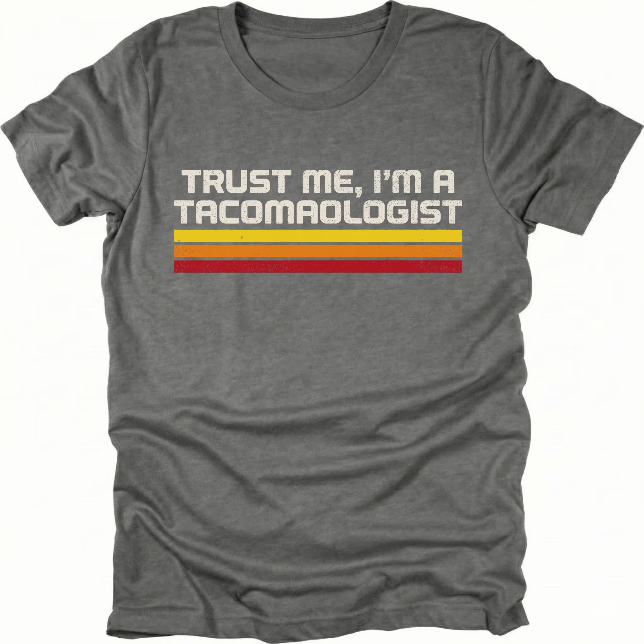 Grey t-shirt with retro stripes and the phrase “Trust Me, I’m a Tacomaologist” printed on the front by Trail Snark.