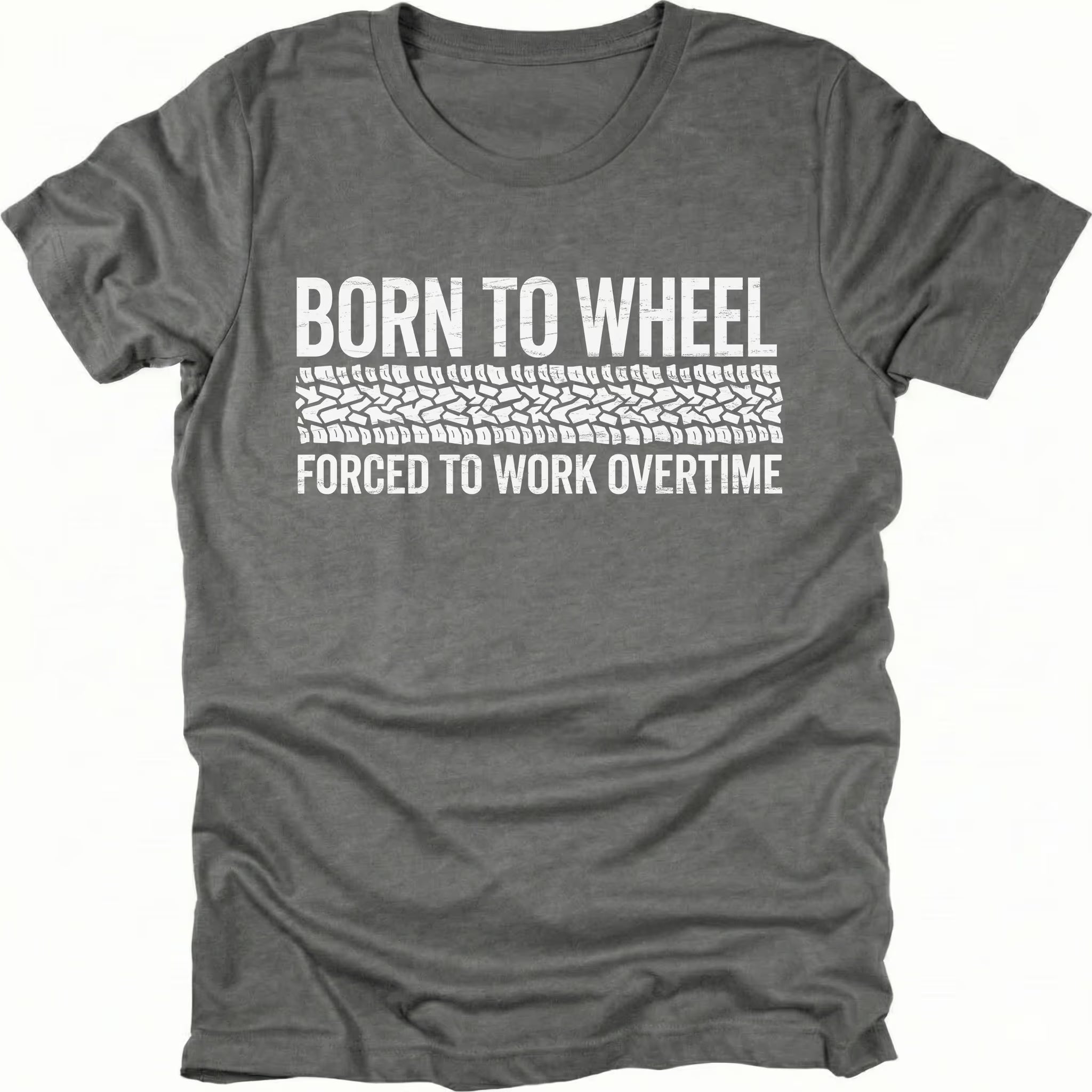 Grey t-shirt featuring born to wheel forced to work overtime text with tire track graphic shown from the front by Trail Snark.
