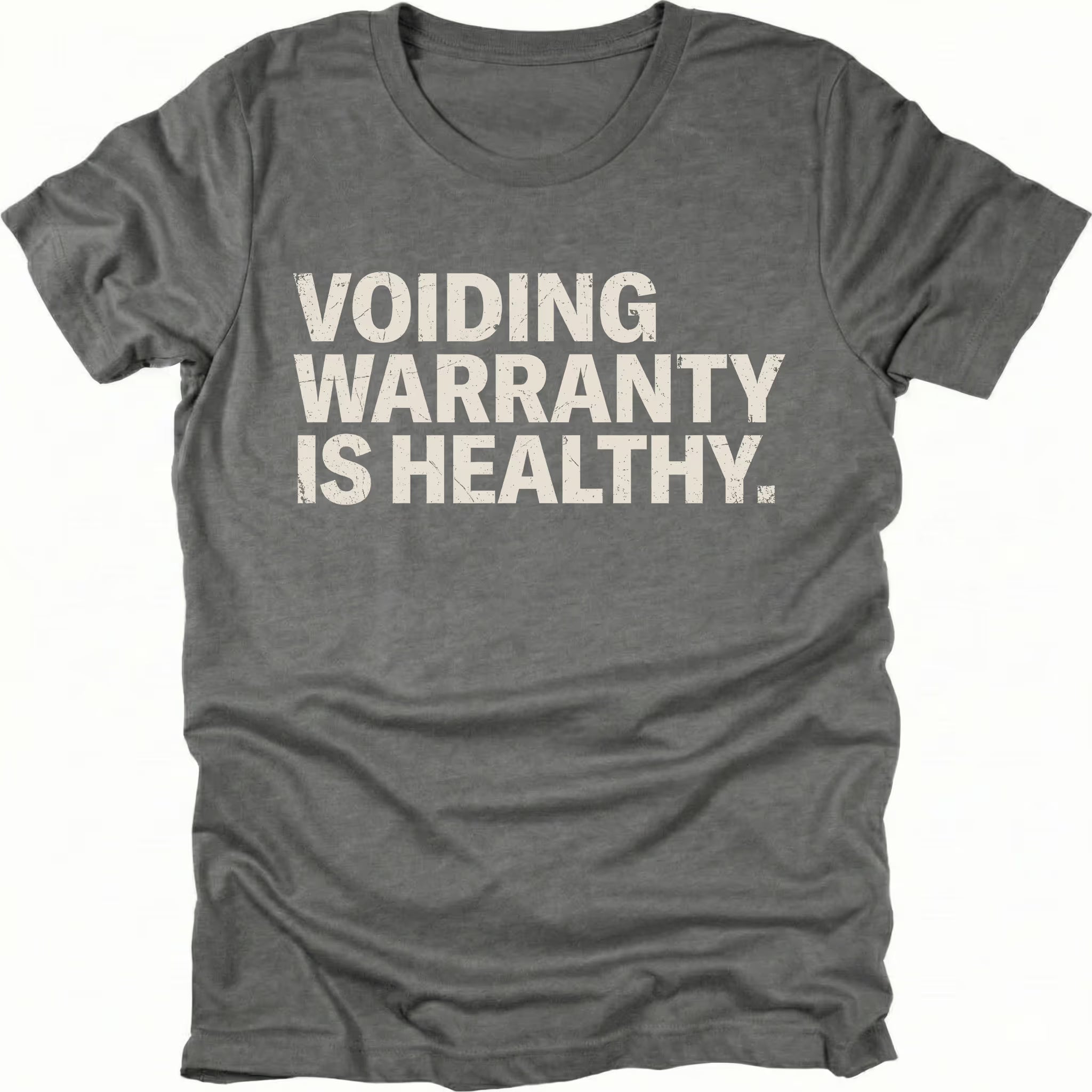 Grey t-shirt with bold text reading “Voiding Warranty Is Healthy” printed on the front.