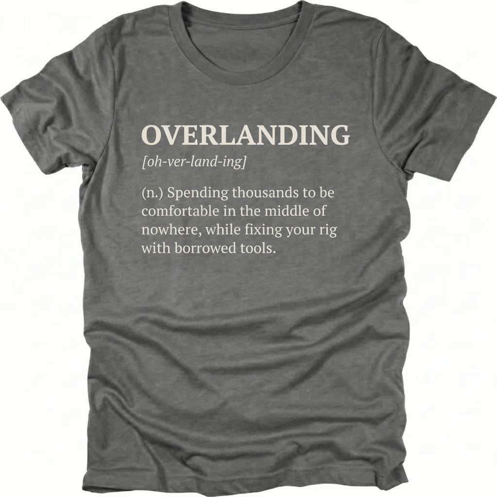 Grey T-Shirt with dictionary-style “Overlanding” definition about fixing rigs with borrowed tools shown on front view by Trail Snark.
