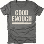 Grey t-shirt featuring bold distressed text reading Good Enough with an underline displayed on the front.