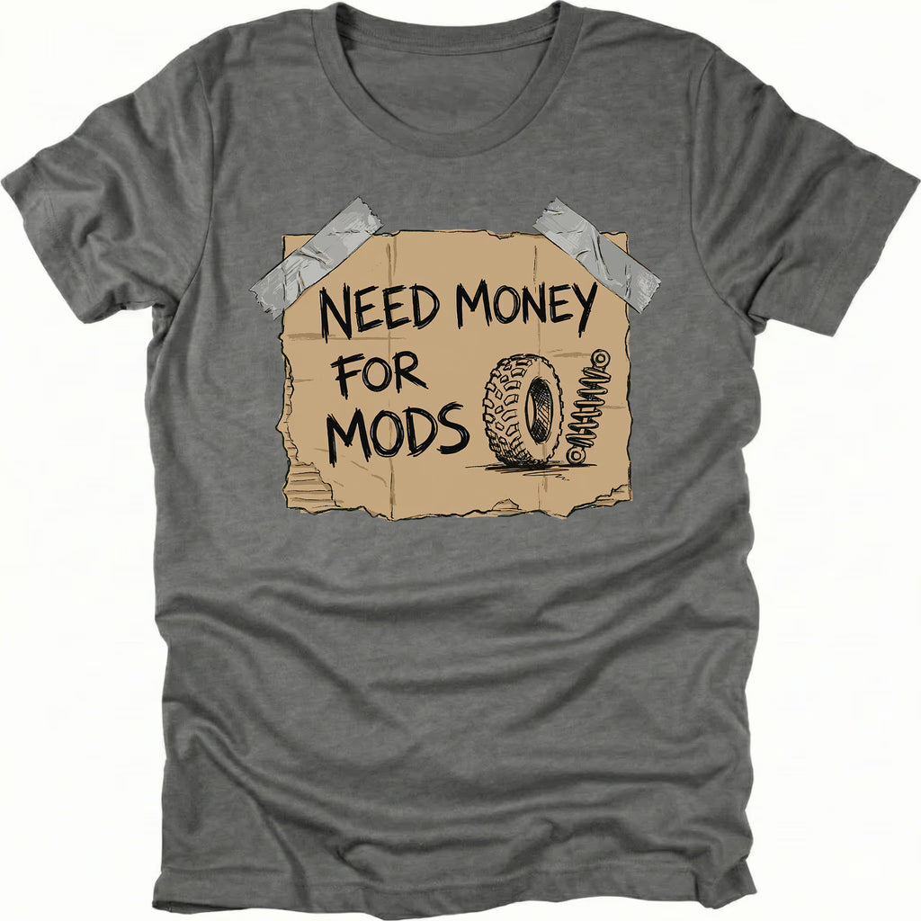 Grey t-shirt featuring a cardboard sign graphic taped at the corners with handwritten text reading Need Money For Mods and a sketch of an offroad tire and suspension.
