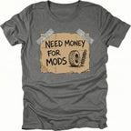 Grey t-shirt featuring a cardboard sign graphic taped at the corners with handwritten text reading Need Money For Mods and a sketch of an offroad tire and suspension.