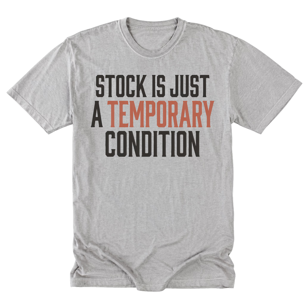 A light steel gray short-sleeve t-shirt with a graphic text print reading 'STOCK IS JUST A TEMPORARY CONDITION' in black and muted orange-red lettering, displayed flat against a white background.