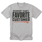 A light heather gray t-shirt with a graphic print that reads 'RECOVERY TEAM'S FAVORITE CUSTOMER' in black, accented by an orange rope and hook illustration, displayed on a clean white background.