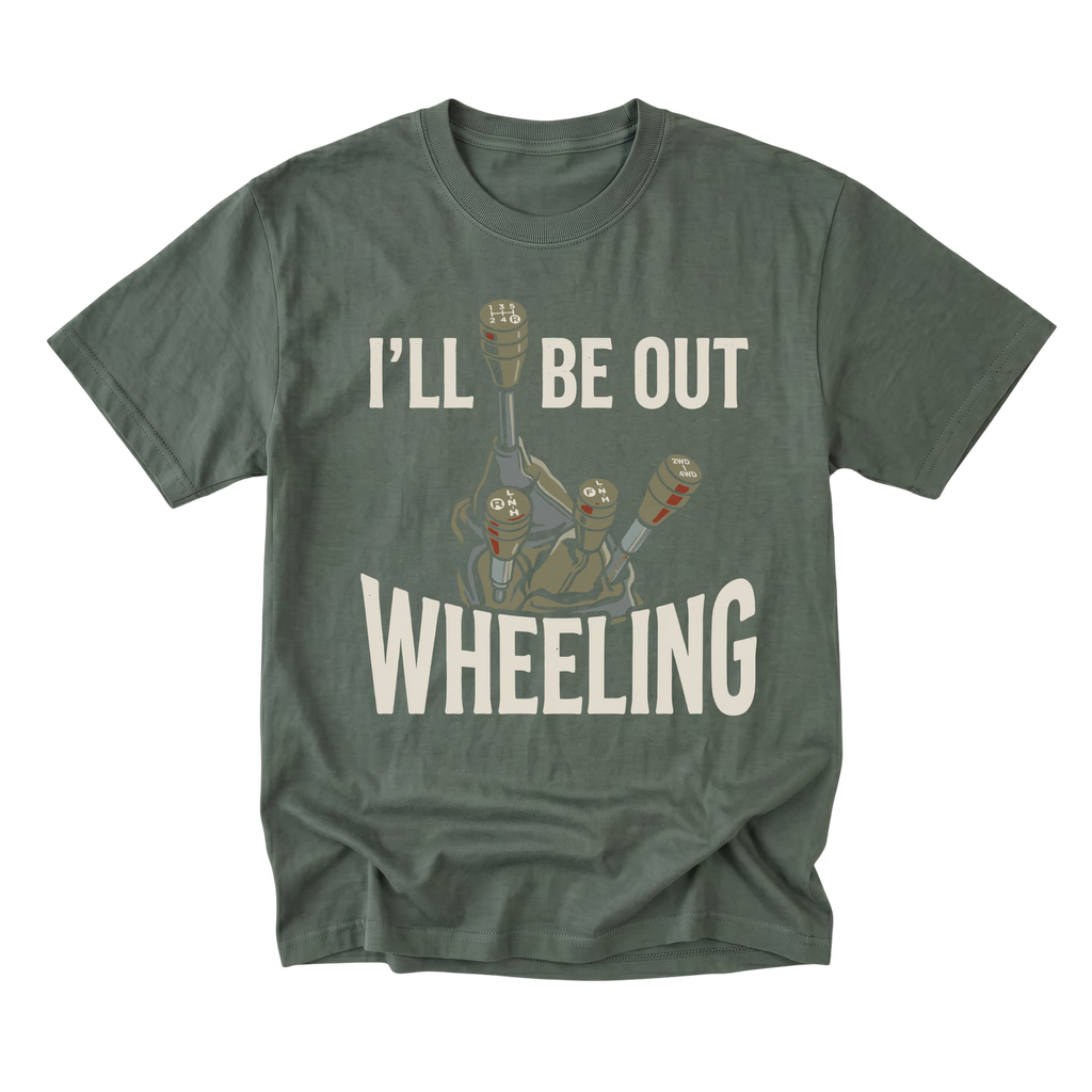 A military green crewneck t-shirt with a graphic print of three small robots and the text 'I'LL BE OUT WHEELING' in white, displayed on a clean white background.