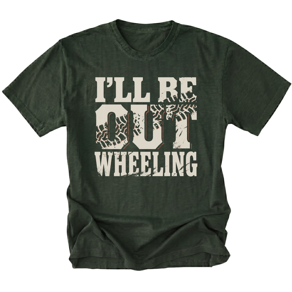 A moss green short-sleeve t-shirt with a distressed graphic on the front that reads 'I'LL BE OUT WHEELING' in off-white lettering, featuring tire tracks inside the letters 'O' and 'U'.