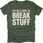 Moss t-shirt with bold distressed text reading I’m Just Here To Break Stuff, front view by Trail Snark.