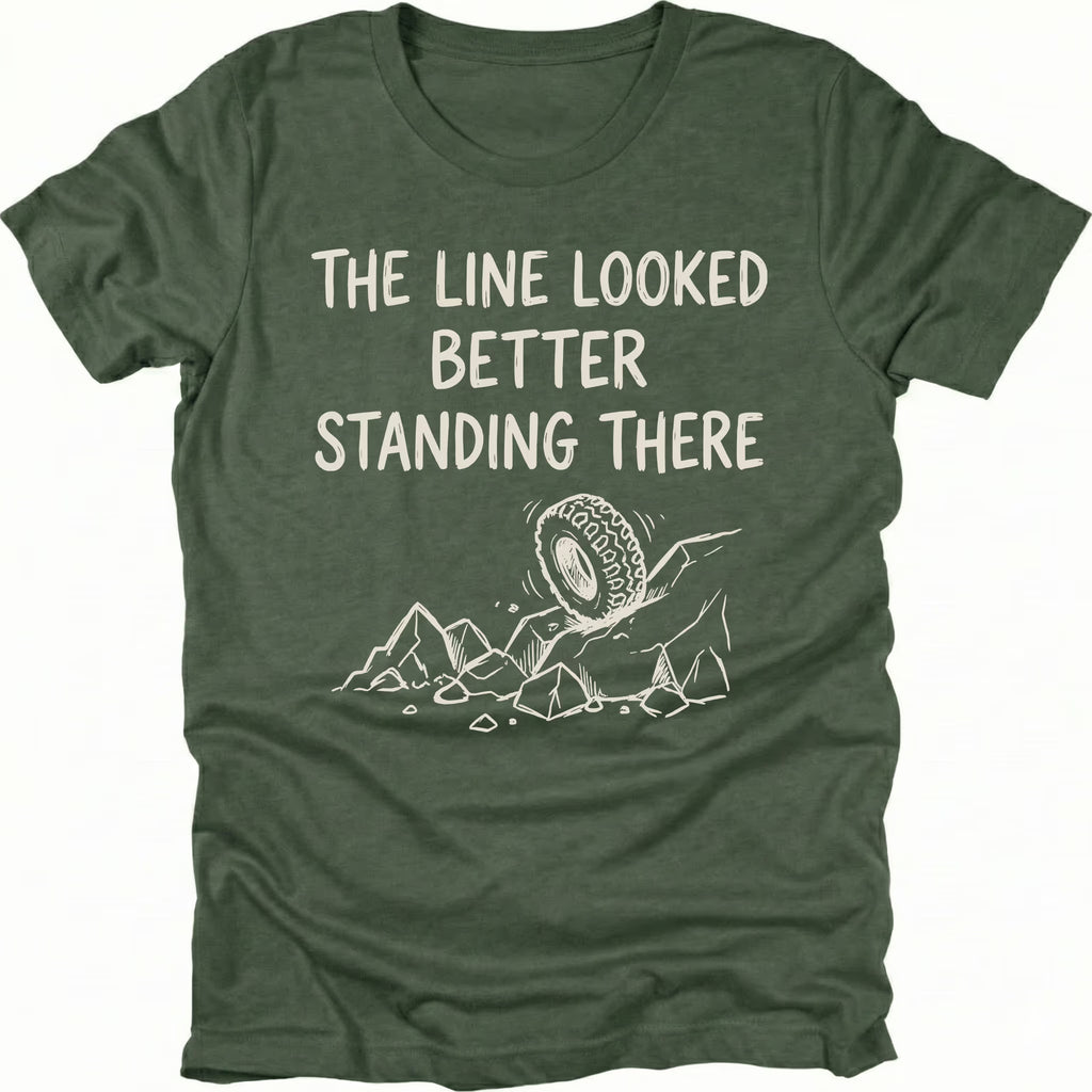 Moss T-Shirt with hand-drawn tire and rocks graphic and text reading “The Line Looked Better Standing There” shown on front view by Trail Snark.