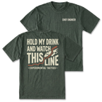 Two moss green t-shirts shown on a white background, displaying both the front and back designs. The front shirt features the text 'CHIEF ENGINEER' in white on the left chest. The back features the text 'HOLD MY DRINK AND WATCH THIS LINE' and smaller text 'EXPERIMENTAL TACTICS' under.