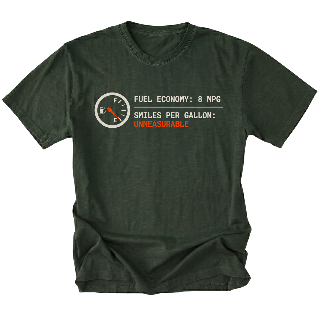 Moss t-shirt featuring a fuel gauge graphic with text reading fuel economy 8 MPG and smiles per gallon unmeasurable displayed on the front.