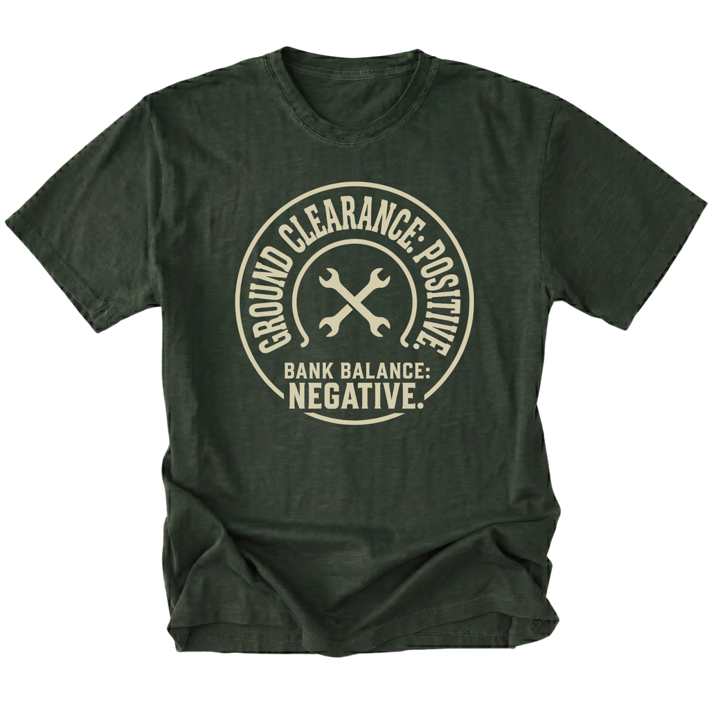Moss T-Shirt with the Ground Clearance: Positive. Bank Balance: Negative. design in a front view by Trail Snark.