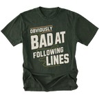 A moss green t-shirt with a distressed graphic print that reads 'OBVIOUSLY BAD AT FOLLOWING LINES' in cream and light olive lettering, displayed on a solid white background.