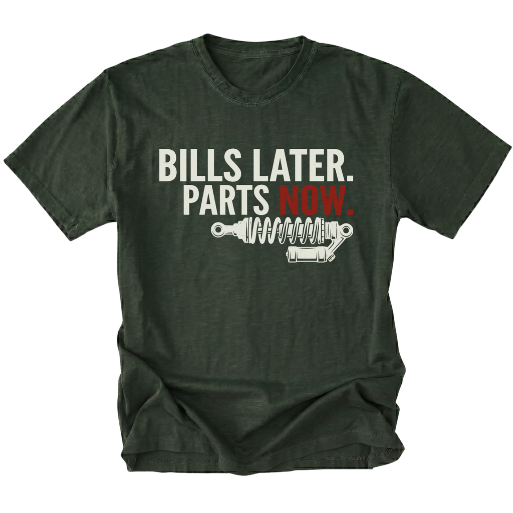 Moss t-shirt featuring Bills Later Parts Now design with suspension coilover graphic on front view by Trail Snark.