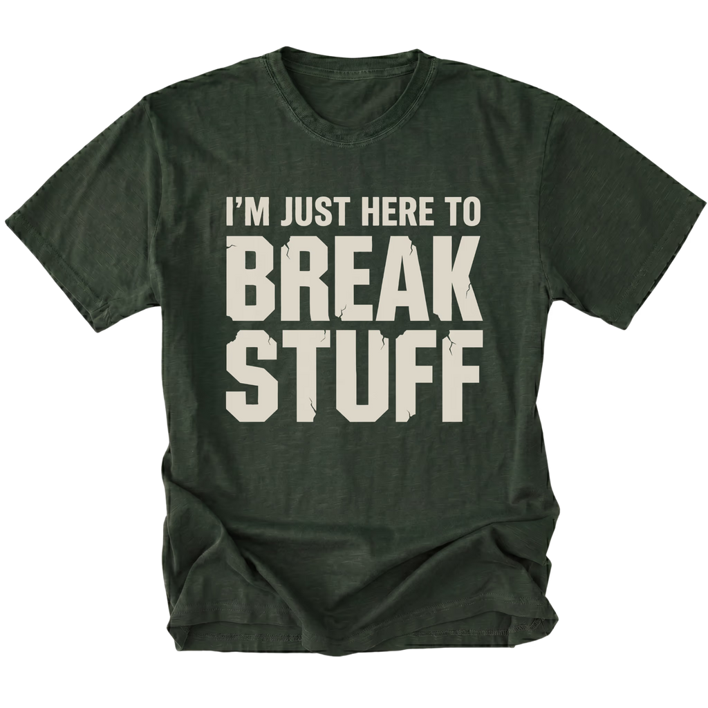 Moss t-shirt with bold distressed text reading I’m Just Here To Break Stuff, front view by Trail Snark.