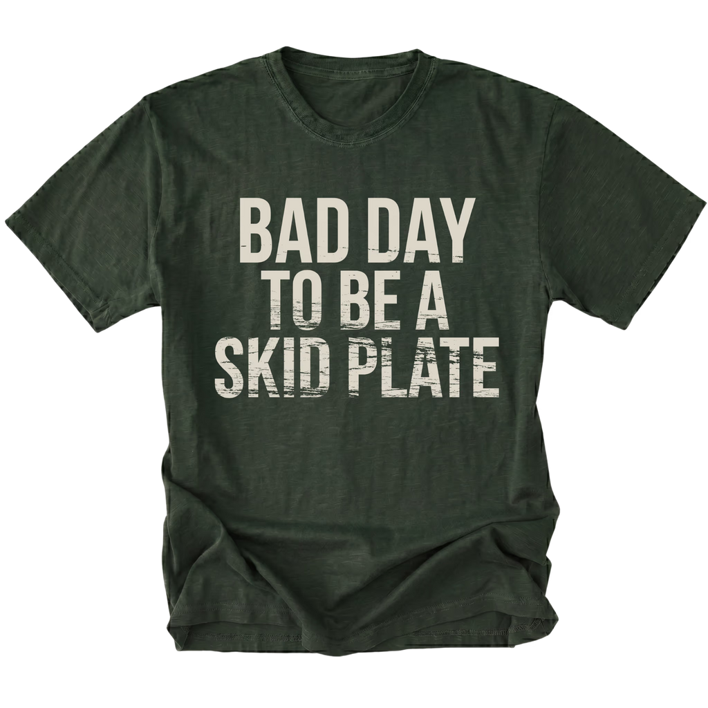 Moss t-shirt featuring bold bad day to be a skid plate text graphic shown from the front by Trail Snark.
