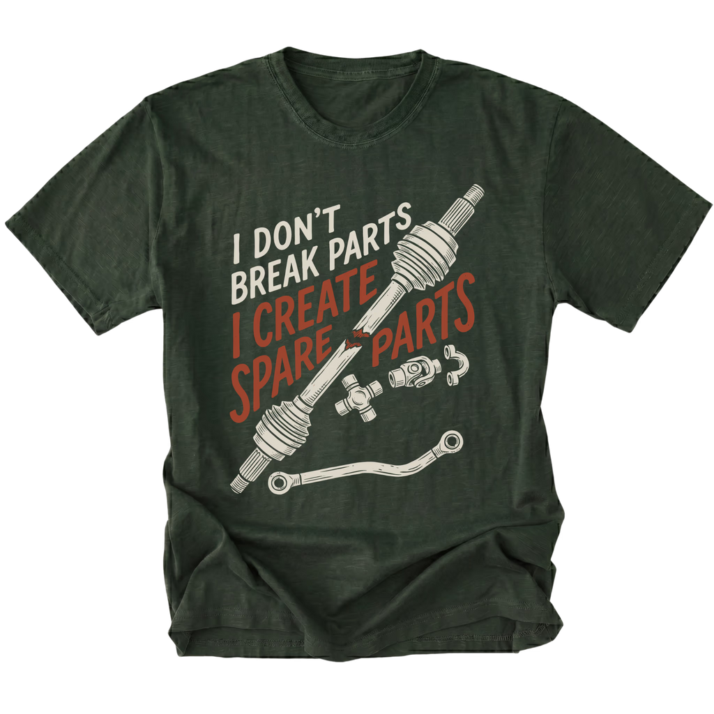 A dark forest green graphic t-shirt featuring a crossed steering column and control arm illustration with the text 'I DON'T BREAK PARTS I CREATE SPARE PARTS' in white and orange-red lettering, displayed on a solid white background.