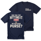 Two navy blue t-shirts shown on a plain white background, with the front and back views overlapping. The back shirt features large white text reading 'DID YOU TRY HITTING IT WITH YOUR PURSE?' and a pink-and-gray hammer graphic.