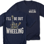 Two navy blue t-shirts shown on a white background, with the back design of one shirt in front and the front chest design of the other behind. The back graphic features the text 'I’LL BE OUT WHEELING' 