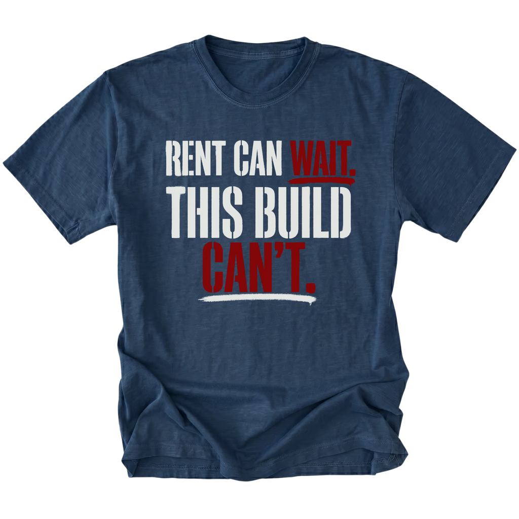 Navy T-Shirt featuring Rent Can Wait This Build Can't text design in bold typography on front view by Trail Snark.