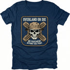 Navy T-Shirt with skull and crossed traction boards reading “Overland Or Die No Pavement Beyond This Point” shown on front view by Trail Snark.