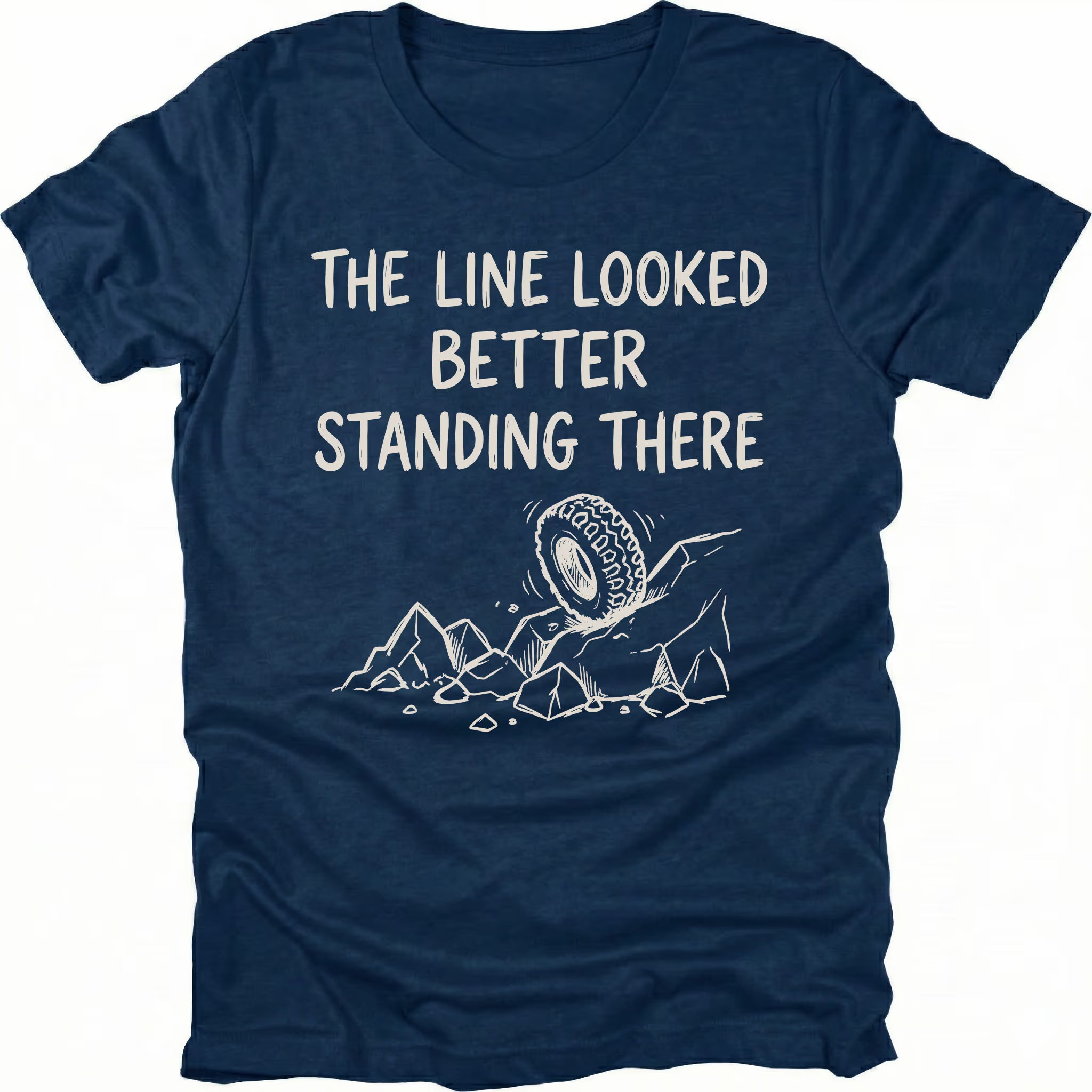 Navy T-Shirt with hand-drawn tire and rocks graphic and text reading “The Line Looked Better Standing There” shown on front view by Trail Snark.