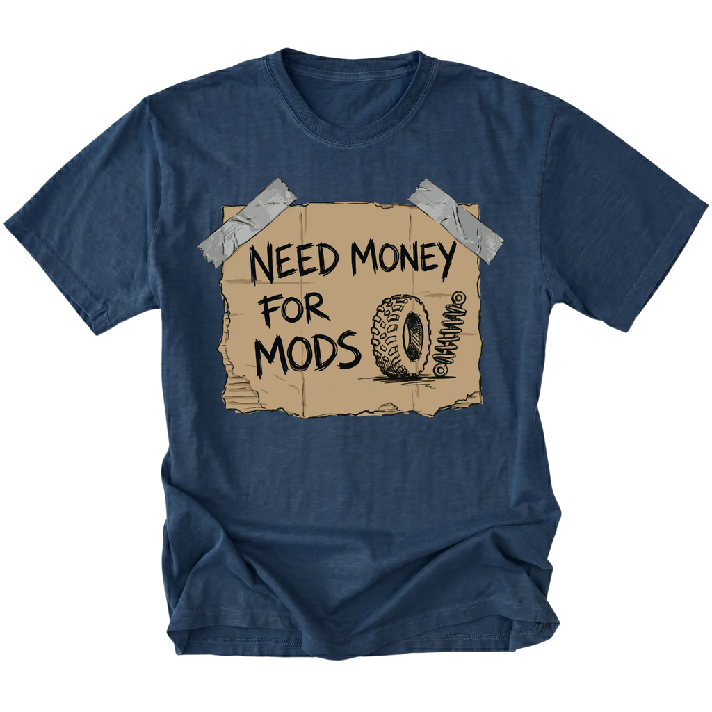 Navy t-shirt featuring a cardboard sign graphic taped at the corners with handwritten text reading Need Money For Mods and a sketch of an offroad tire and suspension.
