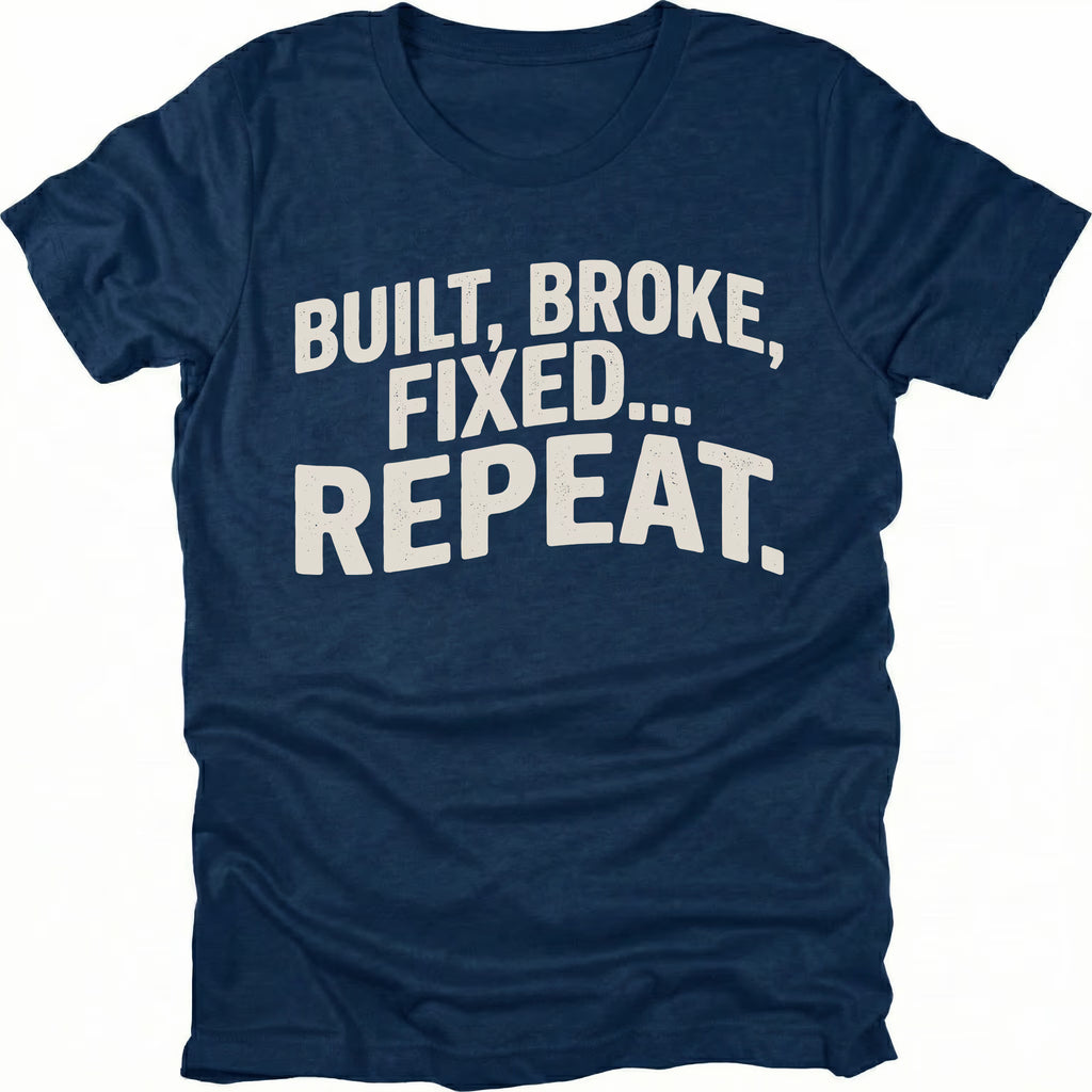 Navy t-shirt featuring built broke fixed repeat bold text graphic shown from the front by Trail Snark.