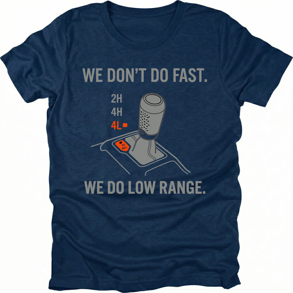 Navy t-shirt featuring a 4x4 transfer case shifter graphic with text reading “We Don’t Do Fast. We Do Low Range.”
