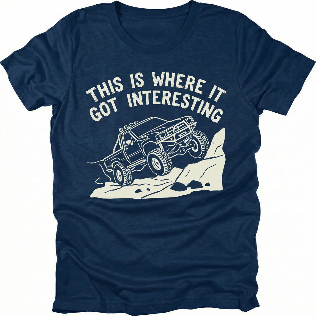 Navy T-Shirt with off-road truck climbing rocks and text reading “This Is Where It Got Interesting” shown on front view by Trail Snark.