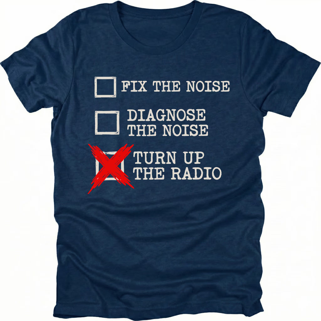 Navy t-shirt with a checklist graphic reading “Fix the Noise, Diagnose the Noise, Turn Up the Radio” printed on the front by Trail Snark.