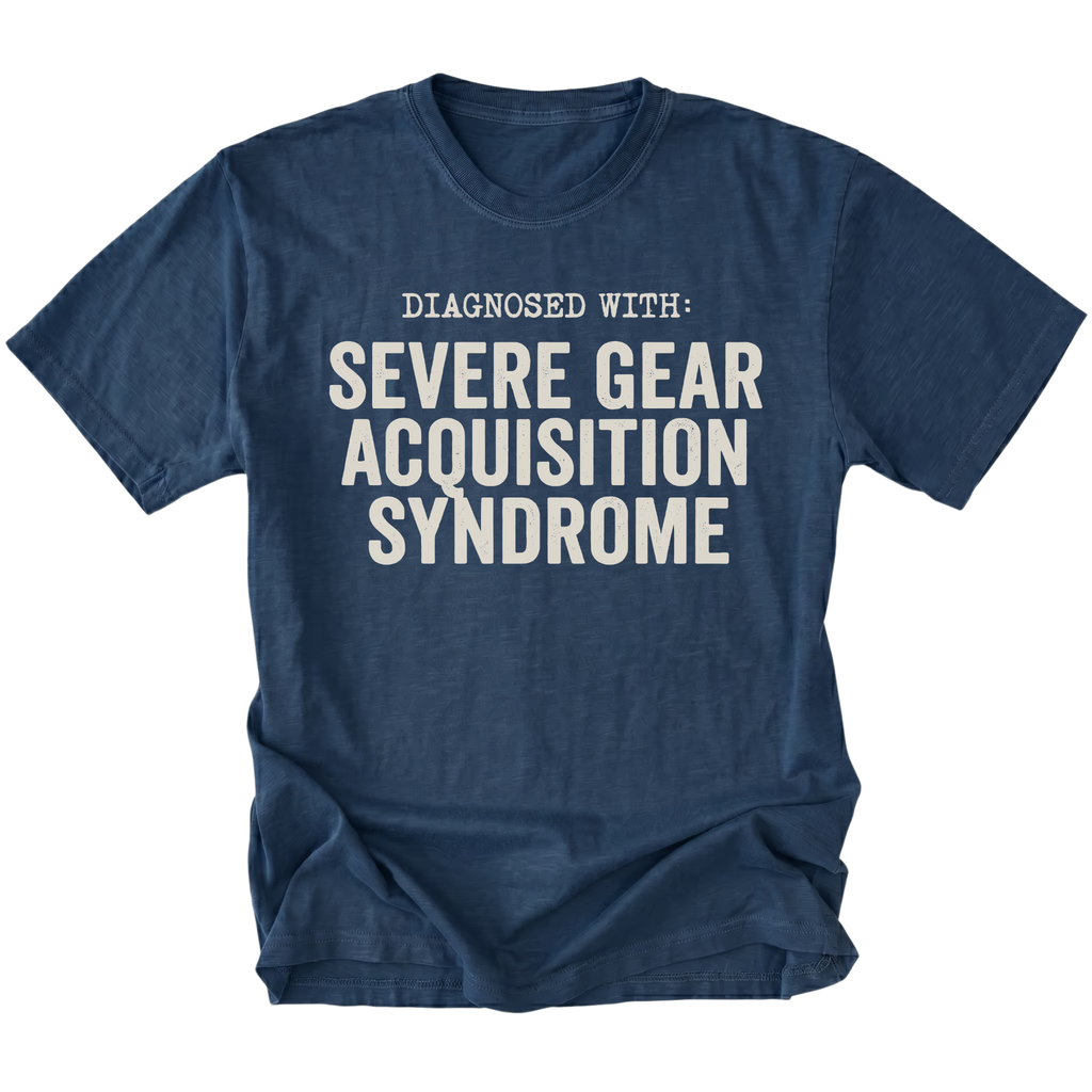 Navy t-shirt featuring diagnosed with severe gear acquisition syndrome bold text graphic shown from the front by Trail Snark.