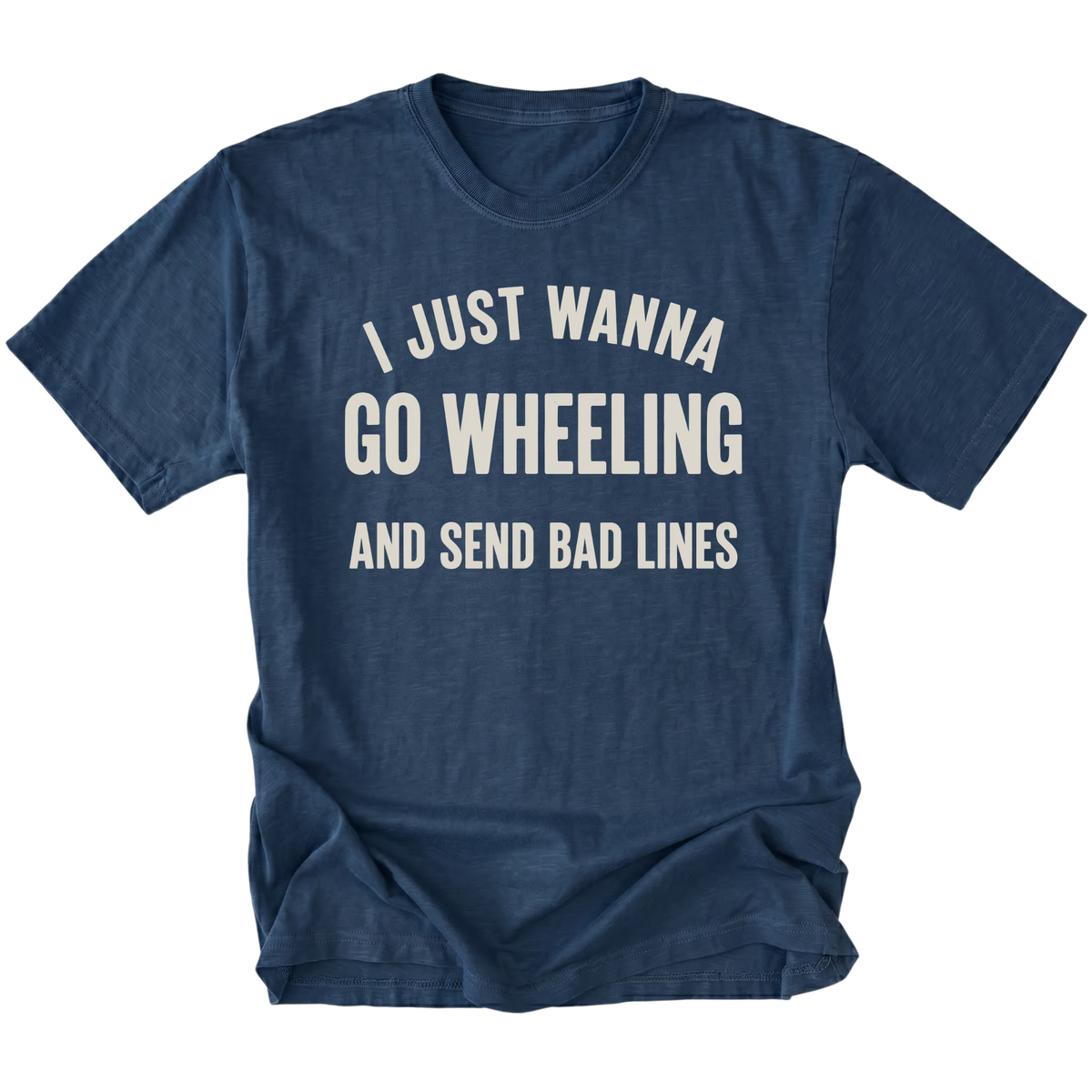 A navy blue short-sleeve t-shirt with a distressed cream-colored graphic text that reads 'I JUST WANNA GO WHEELING AND SEND BAD LINES' on a solid white background.