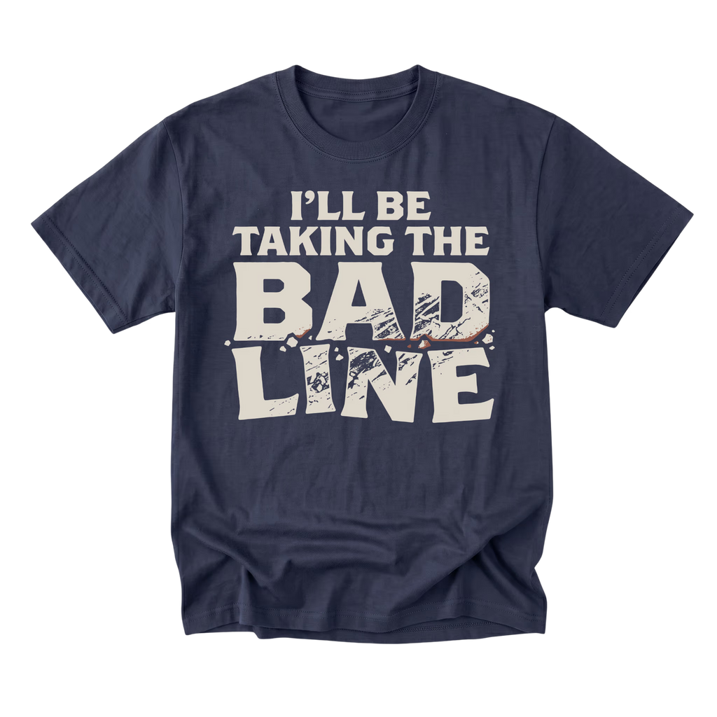 A navy blue short-sleeve t-shirt with a distressed white graphic print that reads 'I'LL BE TAKING THE BAD LINE' across the chest, displayed on a clean white background.