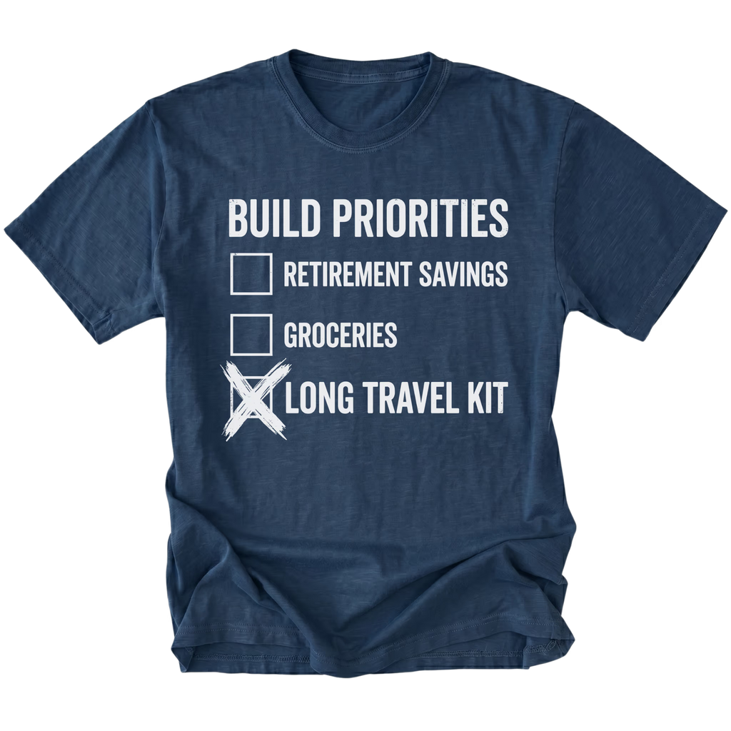 Navy T-Shirt featuring Build Priorities checklist highlighting long travel kit on front view by Trail Snark.