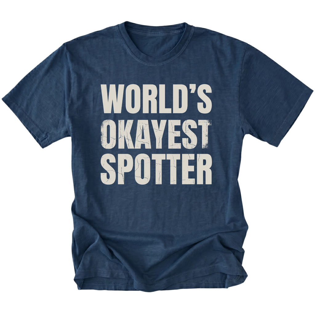 Navy t-shirt with bold distressed text reading “World’s Okayest Spotter.”