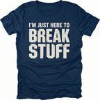 Navy t-shirt with bold distressed text reading I’m Just Here To Break Stuff, front view by Trail Snark.