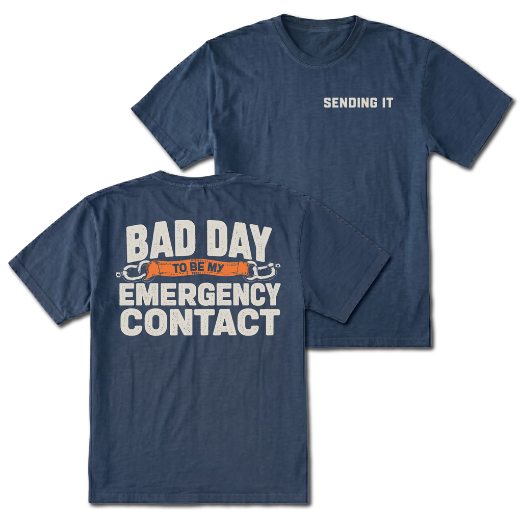 Navy t-shirt featuring the Emergency Contact design on the back and Sending It on the front by Trail Snark.