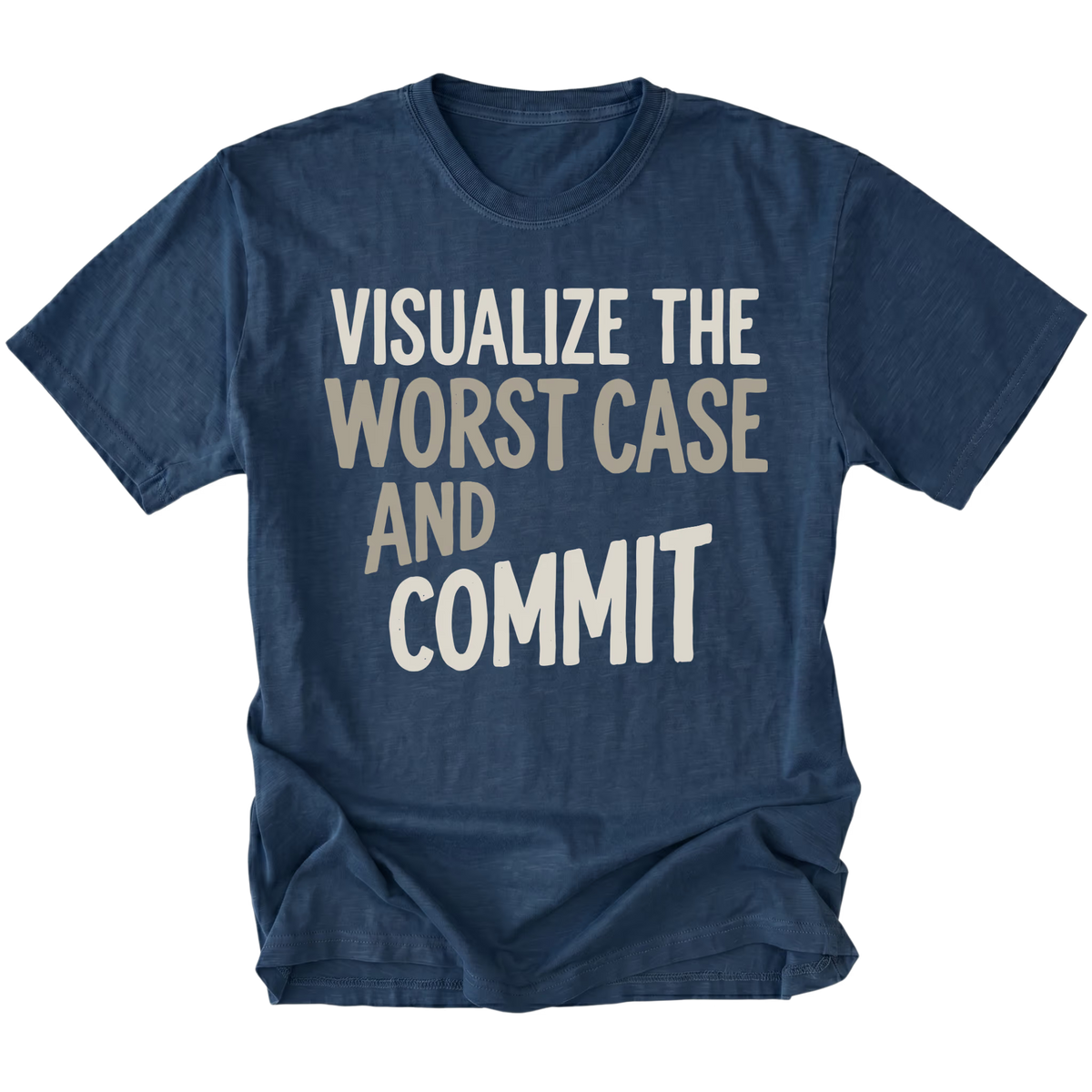 A navy blue short-sleeve t-shirt with a graphic text print reading 'VISUALIZE THE WORST CASE AND COMMIT' in cream and light beige lettering, displayed on a clean white background.