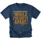 Navy T-shirt with a While I've Got It Apart off-road repair design shown from the front by Trail Snark.