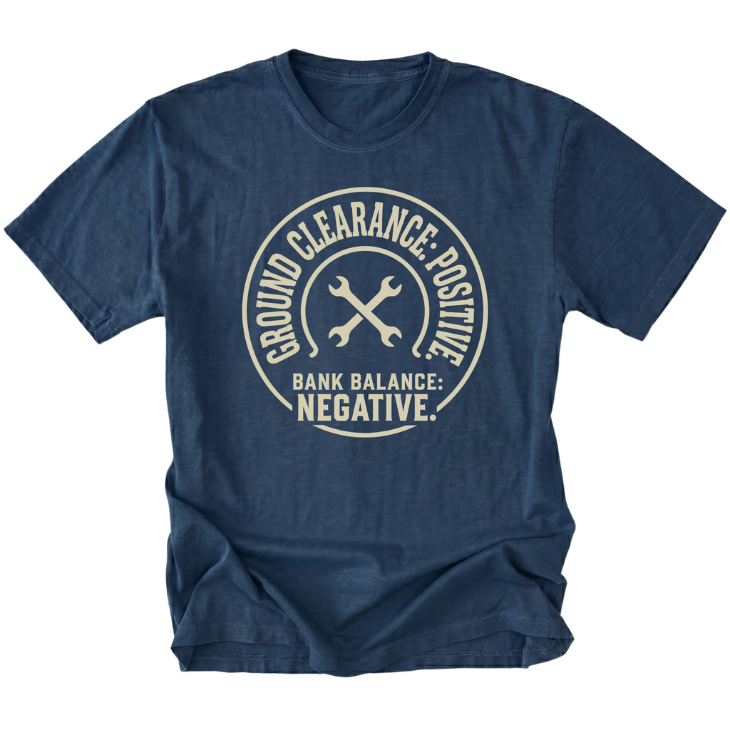 Navy T-Shirt with the Ground Clearance: Positive. Bank Balance: Negative. design in a front view by Trail Snark.