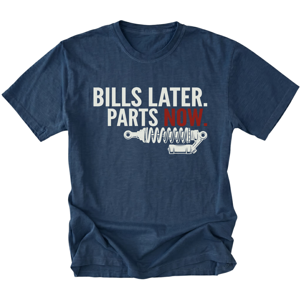 Navy t-shirt featuring Bills Later Parts Now design with suspension coilover graphic on front view by Trail Snark.