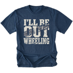 A navy blue short-sleeve t-shirt with a distressed white graphic print that reads 'I'LL BE OUT WHEELING' with tire tracks integrated into the letters, shown on a plain white background.