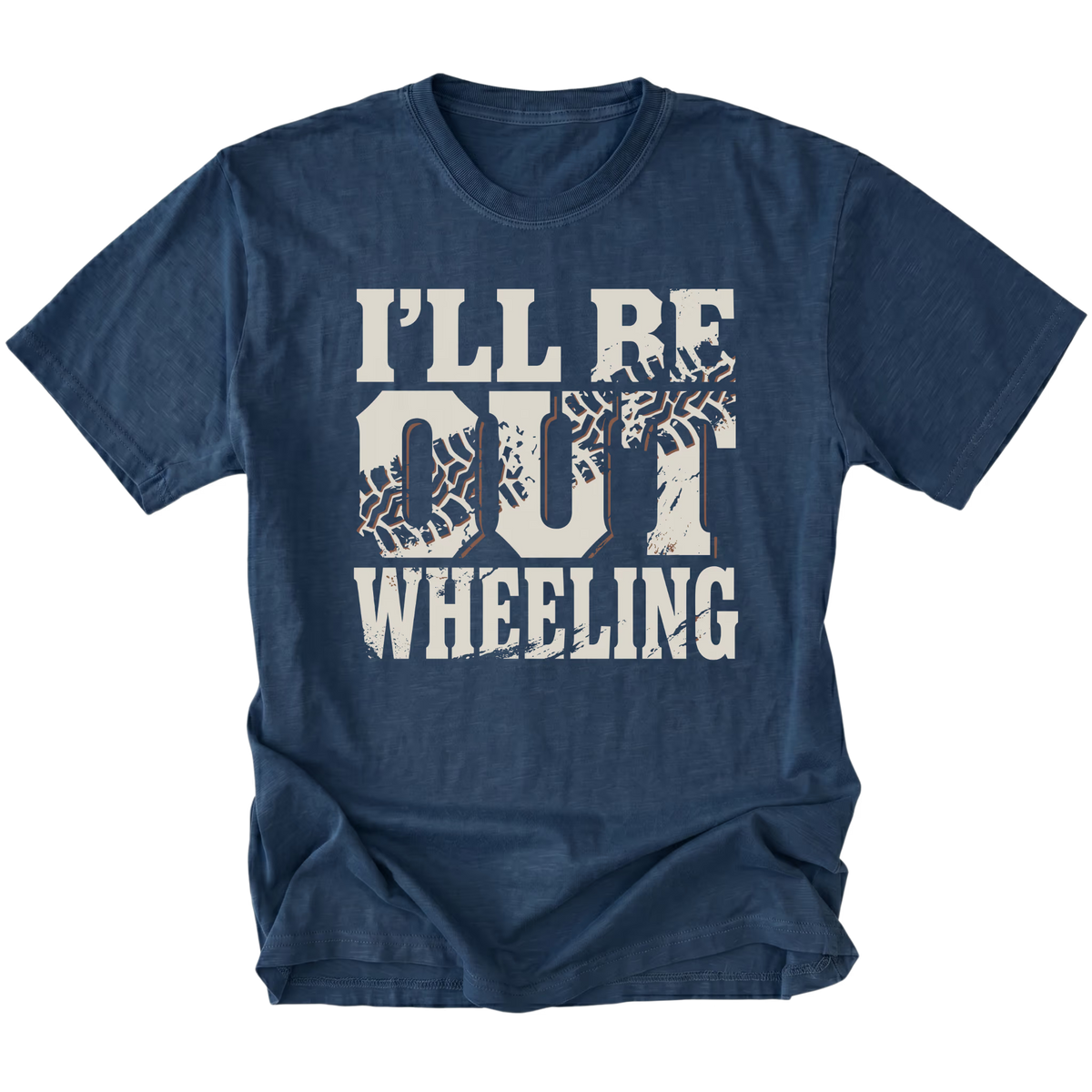 A navy blue short-sleeve t-shirt with a distressed white graphic print that reads 'I'LL BE OUT WHEELING' with tire tracks integrated into the letters, shown on a plain white background.