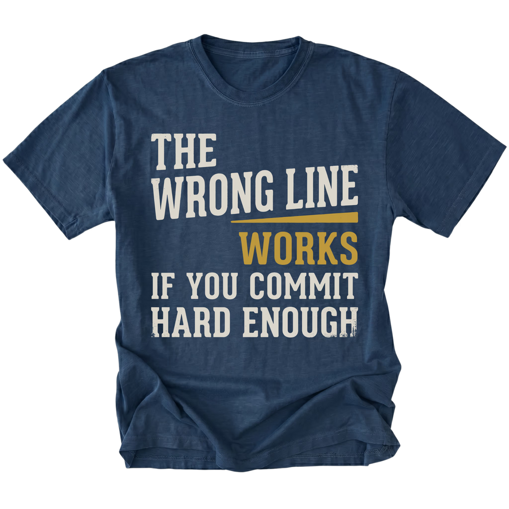 A navy blue short-sleeve t-shirt with a humorous text graphic reading 'THE WRONG LINE WORKS IF YOU COMMIT HARD ENOUGH!' in distressed white and mustard yellow lettering, shown against a plain white background.