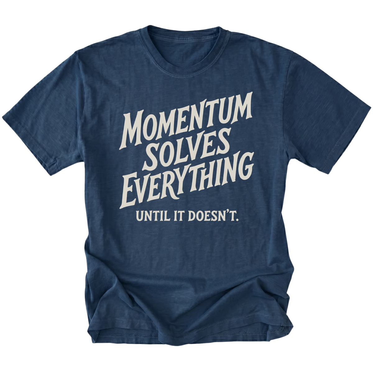 A navy blue heather t-shirt with a distressed white graphic text that reads 'MOMENTUM SOLVES EVERYTHING UNTIL IT DOESN'T.' on a solid white background.