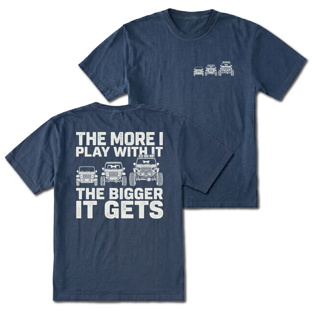 Navy T-shirt with The More I Play With It The Bigger It Gets Jeep build design shown from the back view by Trail Snark.