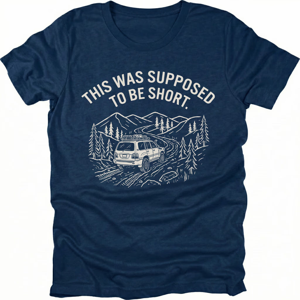 Navy t-shirt with text reading “This Was Supposed to Be Short” above an illustration of an SUV driving a winding forest trail through mountains.
