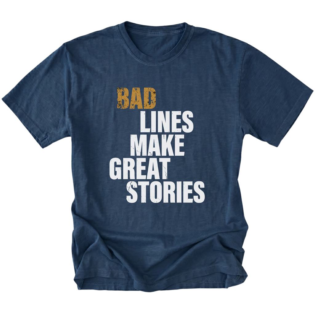Navy t-shirt featuring bad lines make great stories bold text graphic shown from the front by Trail Snark.